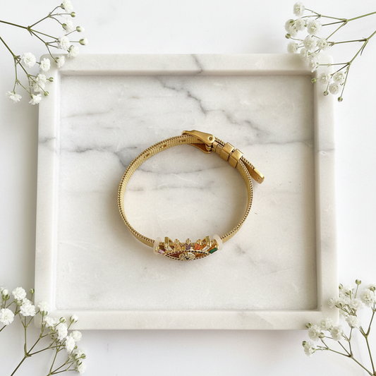 Gold Multicolor Evil Eye Bracelet flat lay on marble tray