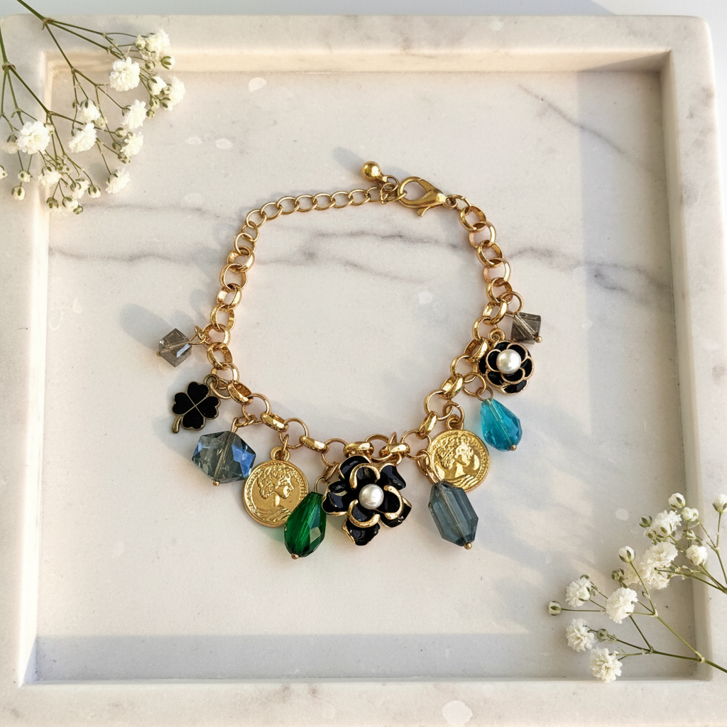 Gold Coin Flower Charm Bracelet flat lay on marble tray