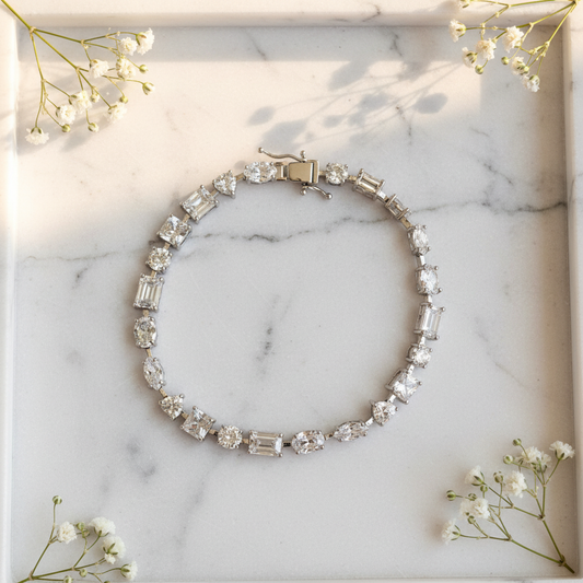 Silver Multi-Cut Tennis Bracelet flat lay on marble tray