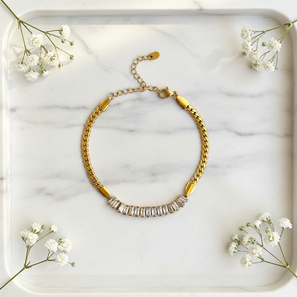 Gold Snake Baguette Crystal Bracelet flat lay on marble tray